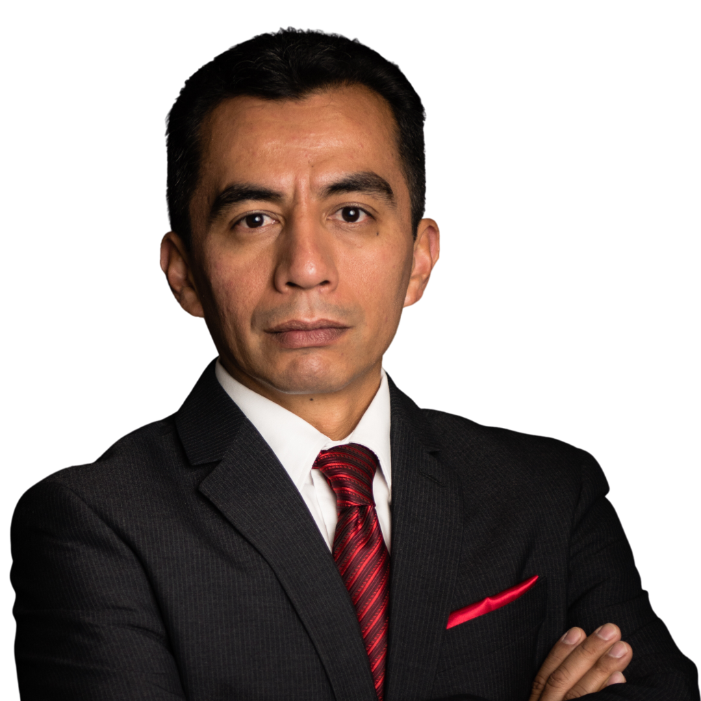 Professional man in a dark suit with red tie and pocket square, posed against a black background.